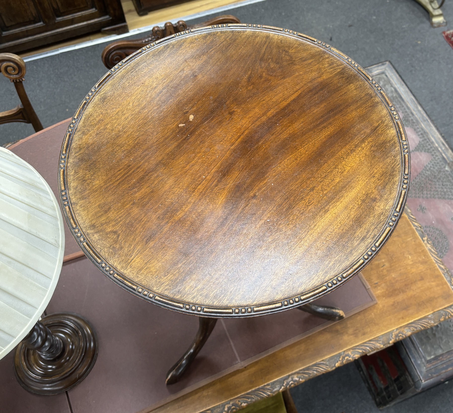 A turned beech table lamp and a circular tripod wine table